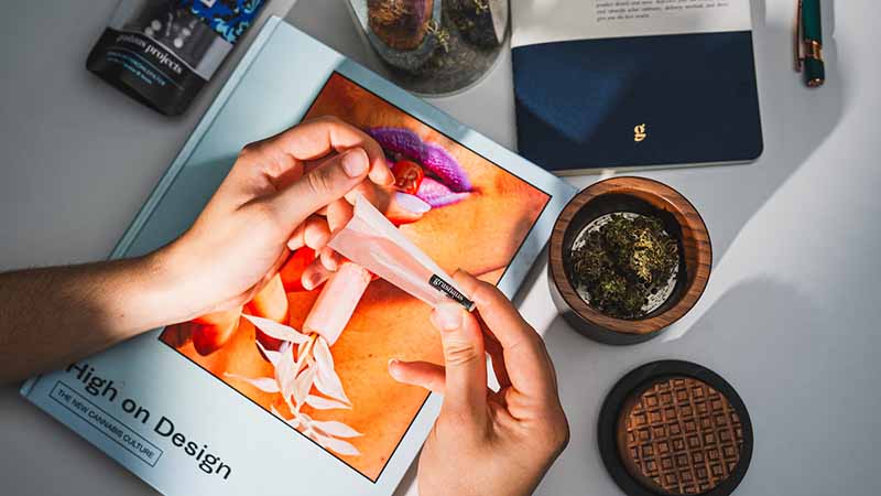 image of person rolling cannabis joint 